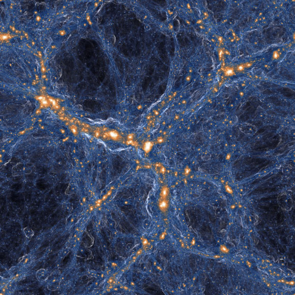 Computer simulation of a region of the Universe wherein a low-density ‘void’ (dark blue region at top center) is surrounded by denser structures containing numerous galaxies (orange/white). Image credit: TNG Collaboration.