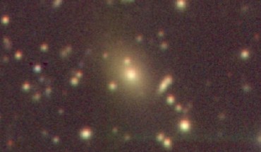 This image shows the newly-discovered galaxy cluster with the central giant elliptical galaxy, which harbors a supermassive black hole. Image credit: Taweewat Somboonpanyakul.