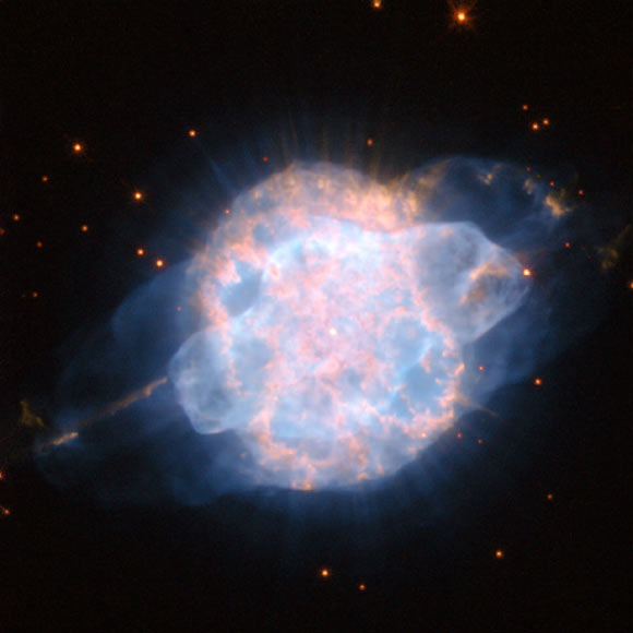 This Hubble image shows the planetary nebula NGC 3918. The color image was made from separate exposures taken in the visible and near-infrared regions of the spectrum with Hubble’s Wide Field Planetary Camera 2 (WFPC2). Several filters were used to sample various wavelengths. The color results from assigning different hues to each monochromatic image associated with an individual filter. Image credit: NASA / ESA / Hubble.