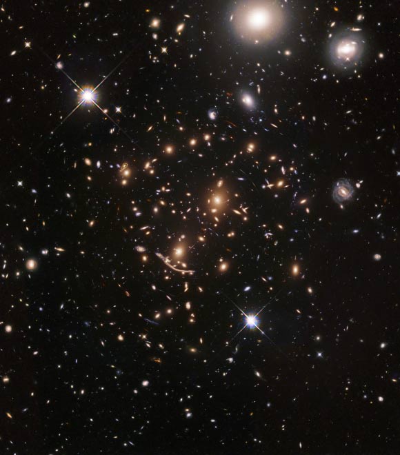 Abell 370, a massive galaxy cluster located in the constellation Cetus, approximately 4 billion light-years away, is the first target of the BUFFALO survey, which aims to search for some of the first galaxies in the Universe. Image credit: NASA / ESA / A. Koekemoer / M. Jauzac / C. Steinhardt / BUFFALO Team.