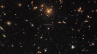 This Hubble image shows a massive group of galaxies bound together by gravity -- a galaxy cluster named SDSS J1050+0017. Image credit: NASA / ESA / Hubble / Judy Schmidt, www.geckzilla.com.
