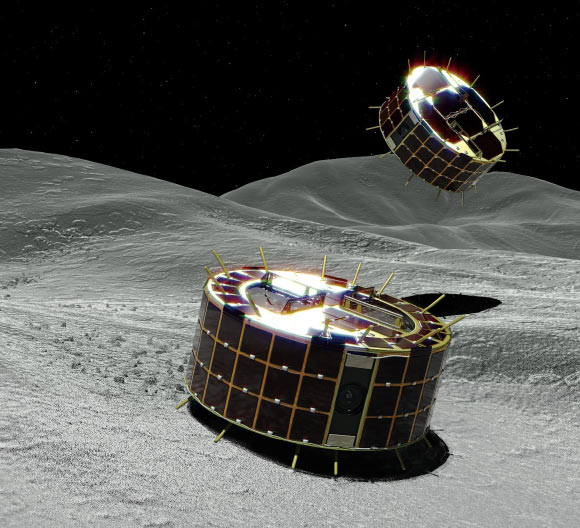 MINERVA-II1 Rover-1A (back) and Rover-1B (foreground) explore the surface of Ryugu. Image credit: JAXA.
