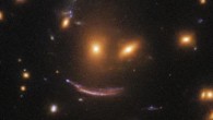 SDSS J0952+3434’s gravity magnifies and distorts a very distant galaxy, which is approximately 11 billion light-years away. Image credit: NASA / ESA / Hubble / Judy Schmidt, www.geckzilla.com.
