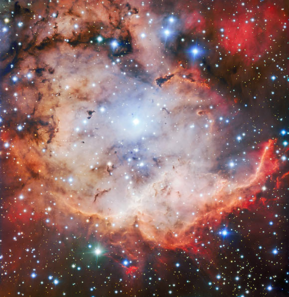 This vivid picture of NGC 2467 was captured with the FORS2 instrument on ESO’s Very Large Telescope. Image credit: ESO.