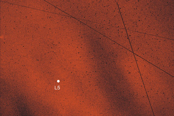 An artist’s impression of the Kordylewski dust cloud in the night sky. Image credit: Gábor Horváth.
