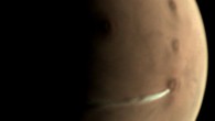 The white, elongated cloud in the vicinity of the Arsia Mons volcano, close to the planet’s equator. Image credit: ESA / GCP / UPV / EHU Bilbao / CC BY-SA 3.0 IGO.