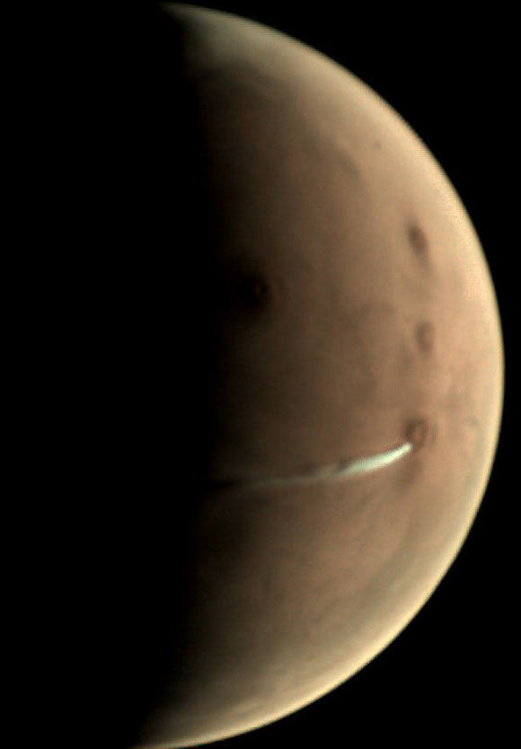 The white, elongated cloud in the vicinity of the Arsia Mons volcano, close to the planet’s equator. Image credit: ESA / GCP / UPV / EHU Bilbao / CC BY-SA 3.0 IGO.