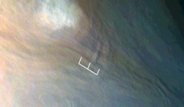 Three waves can be seen in this image, which is an excerpt of a JunoCam image taken on February 2, 2017, during Juno’s fourth flyby of Jupiter. The region imaged in this picture is part of the visibly dark band just north of Jupiter’s equator known as the North Equatorial Belt. Most of this belt is characterized by downwelling motions, but during the fourth flyby it had several bright areas of upwelling clouds. One of those upwelling clouds appears to be accompanied by dark regions, which are most likely shadows. The shadow associated with the center of the three waves is about 25 miles (40 km) long; from the angle of illumination, researchers deduced that the shadowed part of the wave must be around 4 miles (7 km) above the main cloud deck, with the peak of the wave probably close to 6 miles (10 km) above the main cloud deck. Image credit: NASA / JPL-Caltech / SwRI / MSSS / JunoCam.