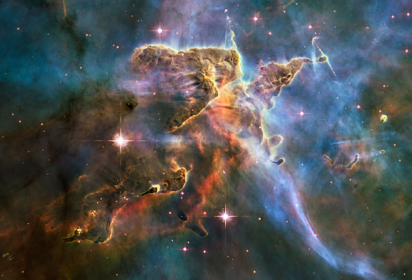 The current, widely recognized model of the Universe, called LambdaCDM, tells us nothing about what dark matter and dark energy are like physically. We only know about them because of the gravitational effects they have on other, observable matter. Dr. Farnes’ model offers a new explanation. Image credit: NASA / ESA / M. Livio / Hubble 20th Anniversary Team, STScI.