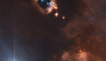 This image from the NASA/ESA Hubble Space Telescope shows the reflection nebula NGC 1333 and associated Herbig-Haro objects. The picture was snapped by Hubble’s Advanced Camera for Surveys (ACS). The image was made through two filters. The color results from assigning different hues to each monochromatic image associated with an individual filter. Image credit: NASA / ESA / Hubble / K. Stapelfeldt.