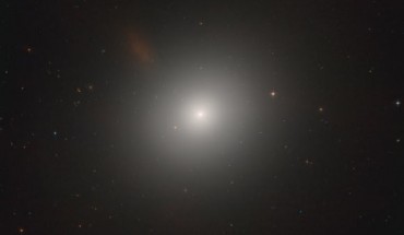 This new image from Hubble shows an elliptical galaxy called Messier 105. Image credit: NASA / ESA / Hubble / C. Sarazin et al.
