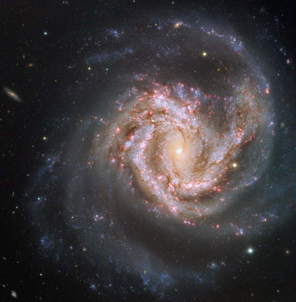 Messier 61 is aligned face-on towards Earth, thus presenting us with a breathtaking view of its structure. The gas and dust of the intricate spiral arms are studded with billions of stars. Image credit: ESO.