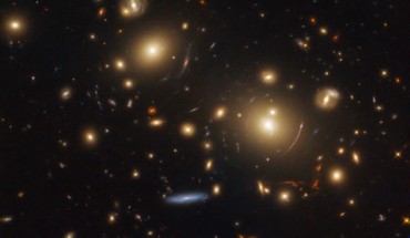 This Hubble image shows a giant cluster of galaxies called SDSS J0928+2031. The image is made up of observations from Hubble’s Wide Field Camera 3 (WFC3) in the infrared and optical parts of the spectrum. It is based on data obtained through four filters. The color results from assigning different hues to each monochromatic image associated with an individual filter. The image was made as part of the Sloan Giant Arcs Survey Program. Image credit: NASA / ESA / Hubble / M. Gladders et al / Judy Schmidt, www.geckzilla.com.