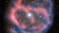 ESO 577-24 was imaged by the FOcal Reducer/low dispersion Spectrograph 2 (FORS2) on ESO’s Very Large Telescope. The FORS2 instrument captured the bright, central star, Abell 36, as well as the surrounding planetary nebula. The red and blue portions of this image correspond to optical emission at red and blue wavelengths, respectively. An object much closer to home is also visible in this image -- an asteroid wandering across the field of view has left a faint track below and to the left of the central star. And in the far distance behind the nebula a glittering host of background galaxies can be seen. Image credit: ESO.