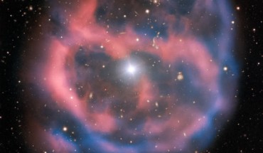 ESO 577-24 was imaged by the FOcal Reducer/low dispersion Spectrograph 2 (FORS2) on ESO’s Very Large Telescope. The FORS2 instrument captured the bright, central star, Abell 36, as well as the surrounding planetary nebula. The red and blue portions of this image correspond to optical emission at red and blue wavelengths, respectively. An object much closer to home is also visible in this image -- an asteroid wandering across the field of view has left a faint track below and to the left of the central star. And in the far distance behind the nebula a glittering host of background galaxies can be seen. Image credit: ESO.