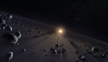 Beyond Neptune, there is a large disk of small objects, called the Kuiper Belt and beyond that is the Oort Cloud, home of the comets. This artwork shows a section of Kuiper Belt, crowded with the icy cores of potential comets. Image credit: M. Kornmesser / ESO.