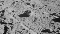 The two Moon-exploring crew men of the Apollo 14 lunar landing mission photographed and collected the large rock pictured just above the exact center of this picture. The rock, casting a shadow off to the left, is the lunar breccia 14321. It lies between the wheel tracks made by the modular equipment transporter (MET) or rickshaw-type portable workbench. A few prints of the lunar overshoes of the crew members are at the left. This photo was made near the boulder field near the rim of Cone Crater. Image credit: NASA.