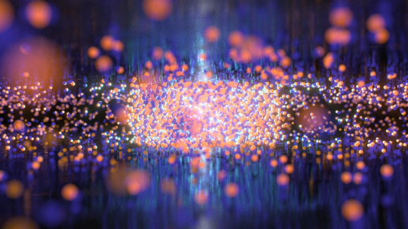 In conventional electronic devices, electricity requires the movement of electrons (blue spheres) and their positive counterparts, called holes (red spheres), which behave much like the gas molecules in our atmosphere. Although they move rapidly and collide infrequently in the gas phase, electrons and holes can condense into liquid droplets akin to liquid water in devices composed of ultrathin materials. Image credit: QMO Lab, University of California, Riverside.