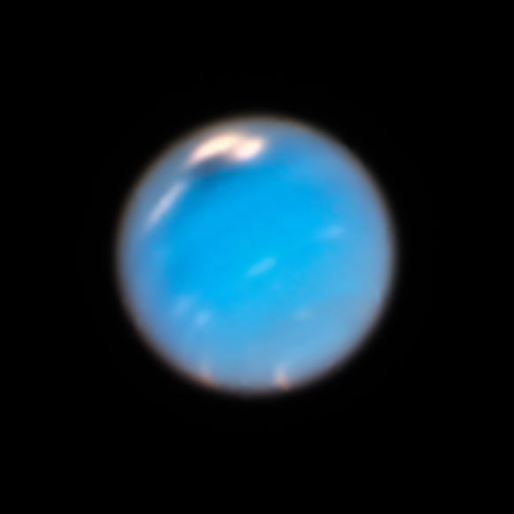 This image, taken by Hubble’s Wide Field Camera 3 (WFC3), shows a new dark storm (top center) on Neptune. Image credit: NASA / ESA / A. Simon, NASA’s Goddard Space Flight Center / M. Wong & A. Hsu, University of California, Berkeley.
