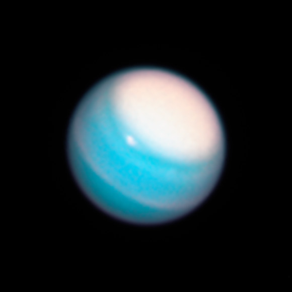 This image, taken by Hubble’s Wide Field Camera 3 (WFC3), reveals a vast bright stormy cloud cap across the north pole of Uranus. Image credit: NASA / ESA / A. Simon, NASA’s Goddard Space Flight Center / M. Wong & A. Hsu, University of California, Berkeley.