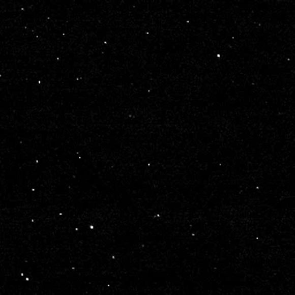 New Horizons team members created this ‘departure movie’ from 14 different images taken by New Horizons’ Long Range Reconnaissance Imager (LORRI) instrument shortly after the spacecraft flew past Ultima Thule on January 1, 2019. The central frame of this sequence was taken at 05:42:42 GMT (12:42 a.m. EST), when New Horizons was 5,494 miles (8,862 km) beyond Ultima Thule, some 4.1 billion miles (6.6 billion km) from Earth. The object’s illuminated crescent is blurred in the individual frames because a relatively long exposure time was used during this rapid scan to boost the camera’s signal level -- but the team combined and processed the images to remove the blurring and sharpen the thin crescent. This is the farthest movie of any object in our Solar System ever made by any spacecraft. The images reveal an outline of the ‘hidden’ portion of the Ultima Thule that was not illuminated by the Sun as the spacecraft zipped by, but can be ‘traced out’ because it blocked the view to background stars also in the image. Image credit: NASA / Johns Hopkins Applied Physics Laboratory / Southwest Research Institute / National Optical Astronomy Observatory.