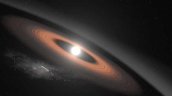 In this illustration, an asteroid (bottom left) breaks apart under the powerful gravity of LSPM J0207+3331, the oldest, coldest white dwarf known to be surrounded by a ring of dusty debris. Image credit: NASA’s Goddard Space Flight Center / Scott Wiessinger.