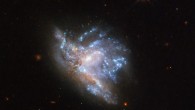 This Hubble image shows two interacting galaxies, known collectively as NGC 6052. The picture was snapped by Hubble’s Wide Field Camera 3 (WFC3). Five filters were used to sample various wavelengths. The color results from assigning different hues to each monochromatic image associated with an individual filter. Image credit: NASA / ESA / Hubble / A. Adamo et al.