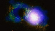 The ‘Teacup’ quasar is causing an ongoing storm. The ‘handle’ is a ring of X-ray (blue) and optical (red and green) light surrounding a giant bubble, shown in the Chandra and Hubble data. This handle-shaped feature, which is located about 30,000 light-years from the galaxy’s central supermassive black hole, was likely formed by one or more eruptions powered by the black hole. Image credit: X-ray -- NASA / CXC / University of Cambridge / G. Lansbury et al; optical - NASA / STScI / W. Keel et al; radio - NRAO / VLA.