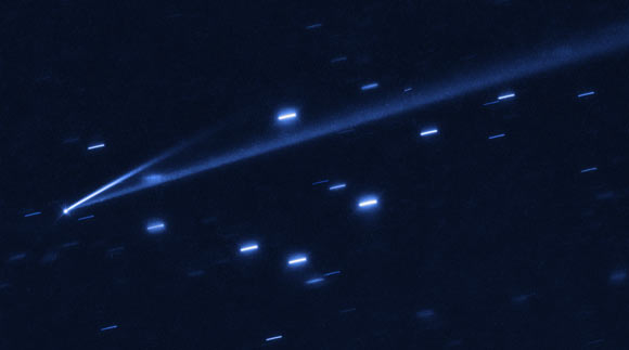 The asteroid (6478) Gault is seen with the NASA/ESA Hubble Space Telescope, showing two narrow, comet-like tails of debris that tell us that the asteroid is slowly undergoing self-destruction. The bright streaks surrounding the asteroid are background stars. Image credit: NASA / ESA / K. Meech & J. Kleyna, University of Hawaii / O. Hainaut, European Southern Observatory.