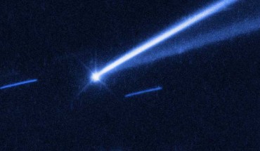 The asteroid (6478) Gault is seen with the NASA/ESA Hubble Space Telescope, showing two narrow, comet-like tails of debris that tell us that the asteroid is slowly undergoing self-destruction. The bright streaks surrounding the asteroid are background stars. Image credit: NASA / ESA / K. Meech & J. Kleyna, University of Hawaii / O. Hainaut, European Southern Observatory.