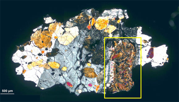 Thin section of ALH-77005: poikilitic texture of olivine with pyroxene cumulate grains, the studied melt pocket (rectangle) mostly composed of olivine. Image credit: Gyollai et al, doi: 10.1515/astro-2019-0002.