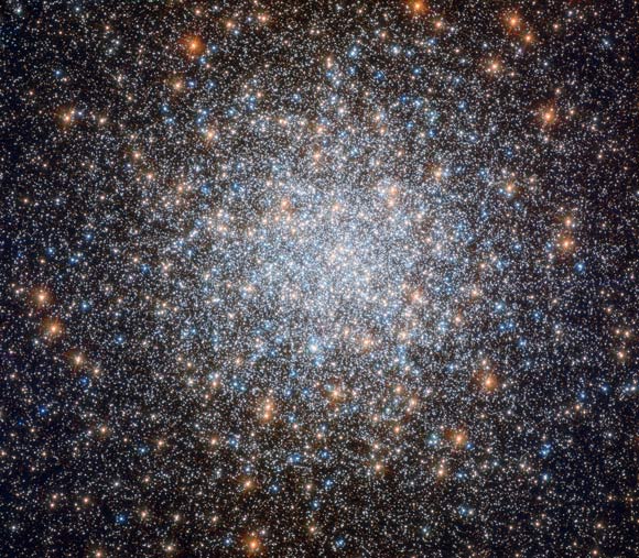 This Hubble image shows the globular cluster Messier 3. The color image was made from separate exposures taken in the visible and ultraviolet regions of the spectrum with Hubble’s Wide Field Camera 3 (WFC3). Five filters were used to sample various wavelengths. The color results from assigning different hues to each monochromatic image associated with an individual filter. Image credit: NASA / ESA / Hubble / G. Piotto et al.