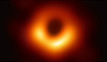 The EHT Collaboration unveiled the first direct visual evidence of the supermassive black hole in the center of the elliptical galaxy Messier 87 and its shadow. The shadow of a black hole seen here is the closest we can come to an image of the black hole itself, a completely dark object from which light cannot escape. The black hole’s boundary -- the event horizon from which the EHT takes its name -- is around 2.5 times smaller than the shadow it casts and measures just under 25 billion miles (40 billion km) across. Image credit: EHT Collaboration.