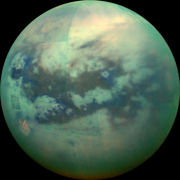 A false-color view of Titan, a moon of Saturn surrounded by a thick orange haze. Image credit: NASA / JPL / University of Arizona / University of Idaho.