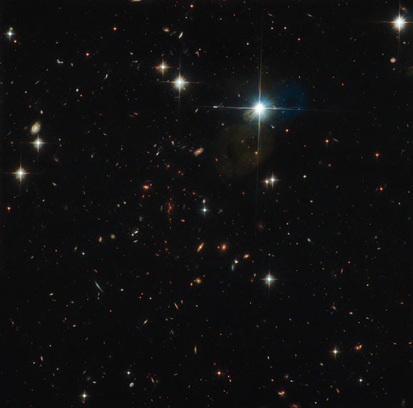 This Hubble image shows the massive galaxy cluster SPT-CL J0615-5746. Image credit: NASA / ESA / Hubble / Karachentsev et al / High et al.