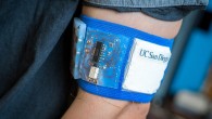 Prototype of the cooling and heating patch embedded in a mesh armband. Image credit: David Baillot / Jacobs School of Engineering, University of California, San Diego.