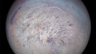 Voyager 2 image of Triton showing the south polar region with dark streaks produced by geysers visible on the icy surface. Image credit: NASA / JPL.