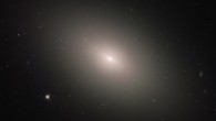 This Hubble image shows the elliptical galaxy Messier 59. This image is a composite of separate exposures acquired by Hubble’s Wide Field and Planetary Camera 2 (WFPC2) and Advanced Camera for Surveys (ACS). Four filters were used to sample various wavelengths. The color results from assigning different colors to each monochromatic image associated with an individual filter. Image credit: NASA / ESA / Hubble / P. Cote.