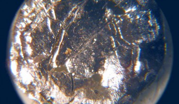 A small disk of americium-241 under the microscope. Image credit: Bionerd / CC BY 3.0.