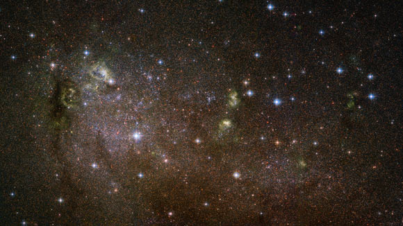 This Hubble image shows the irregular galaxy IC 10. The image is made up of observations from Hubble’s Advanced Camera for Surveys (ACS) in the optical part of the spectrum. It is based on data obtained through three filters. The color results from assigning different hues to each monochromatic image associated with an individual filter. Image credit: NASA / ESA / Hubble / F. Bauer.
