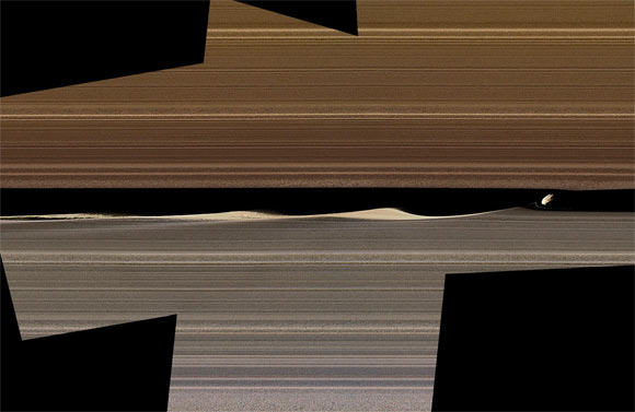 This enhanced-color image mosaic shows Daphnis in the Keeler gap on the sunlit side of the rings. Daphnis is seen kicking up three waves in the gap’s outer edge. Image credit: NASA / JPL-Caltech / Space Science Institute.