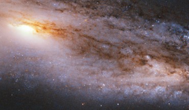 This Hubble image shows the spiral galaxy Messier 98. The image is a composite of separate exposures acquired by Hubble’s Wide Field and Planetary Camera 2 (WFPC2). Two filters were used to sample various wavelengths. The color results from assigning different hues to each monochromatic image associated with an individual filter. Image credit: NASA / ESA / Hubble / V. Rubin et al.