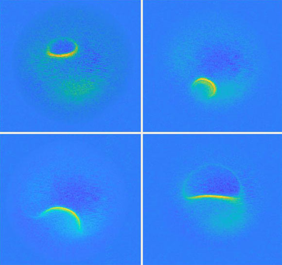 MRI scans on top of a titanium atom taken at different energies; the bright areas mark positions where the atom’s magnetic field is the same. Image credit: Willke et al.