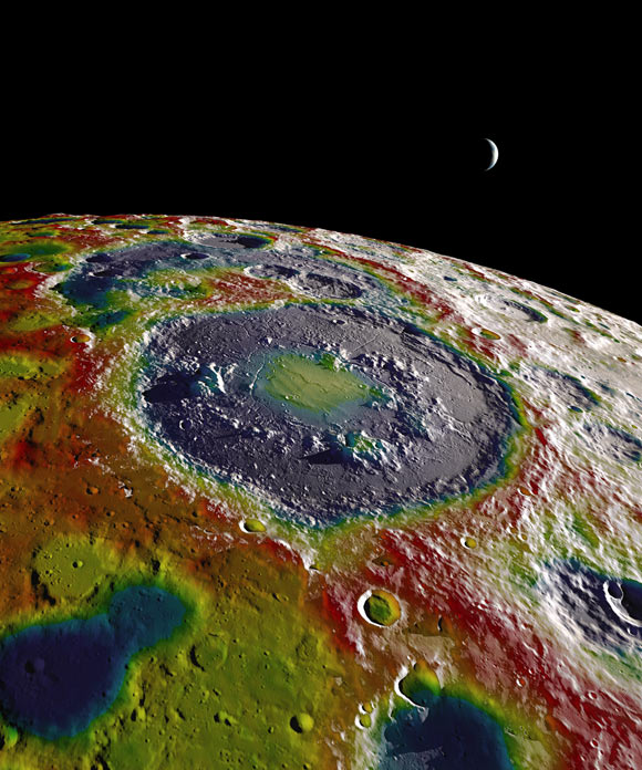 A high-resolution free-air gravity map based on data returned from NASA’s Gravity Recovery and Interior Laboratory (GRAIL) mission, overlaid on terrain based on NASA’s Lunar Reconnaissance Orbiter (LRO) altimeter and camera data. The view is south-up, with the south pole near the horizon in the upper left. The terminator crosses the eastern rim of the Schrödinger basin. Gravity is painted onto the areas that are in or near the night side. Red corresponds to mass excesses and blue to mass deficits. Image credit: NASA’s Scientific Visualization Studio.