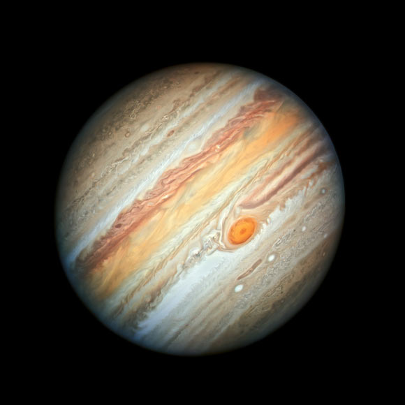 This new Hubble image of Jupiter, taken on June 27, 2019, reveals the giant planet’s Great Red Spot, and a more intense color palette in the clouds swirling in Jupiter's turbulent atmosphere than seen in previous years. The colors, and their changes, provide important clues to ongoing processes in Jupiter’s atmosphere. The bands are created by differences in the thickness and height of the ammonia ice clouds. The colorful bands, which flow in opposite directions at various latitudes, result from different atmospheric pressures. Lighter bands rise higher and have thicker clouds than the darker bands. Image credit: NASA / ESA / A. Simon, NASA’s Goddard Space Flight Center / M.H. Wong, University of California, Berkeley.