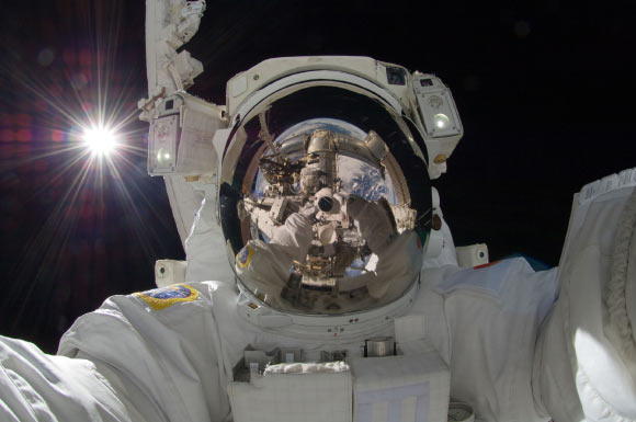 JAXA astronaut Aki Hoshide, ISS Expedition 32 flight engineer, taking a space selfie during extravehicular activity on September 5, 2012, with the Sun behind him. Image credit: NASA.