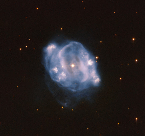This Hubble image shows the planetary nebula NGC 5307. The color image was made from separate exposures taken in the visible and near-infrared regions of the spectrum with Hubble’s Advanced Camera for Surveys (ACS). It is based on data obtained through two filters. The color results from assigning different hues to each monochromatic image associated with an individual filter. Image credit: NASA / ESA / Hubble / R. Wade et al.
