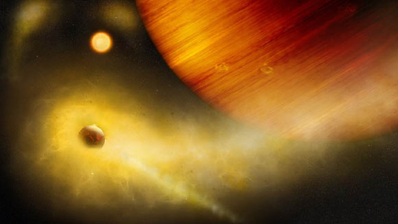 An artist’s impression of an exo-Io undergoing extreme mass loss. The hidden exomoon is enshrouded in an irradiated gas cloud shining in bright orange-yellow, as would be seen with a sodium filter. Patches of sodium clouds are seen to trail the lunar orbit, possibly driven by the gas giant’s magnetosphere. Image credit: Thibaut Roger / University of Bern.