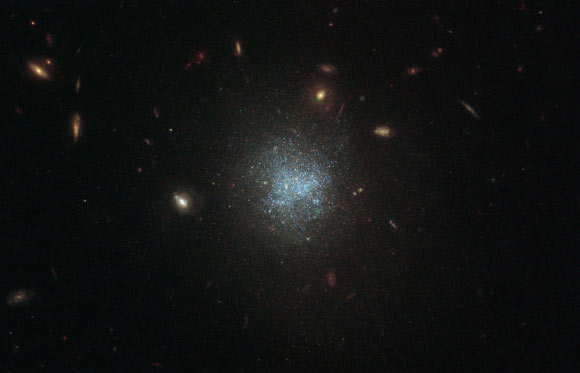 This Hubble image shows the dwarf galaxy UGC 695. The picture is made up of observations from Hubble’s Wide Field Camera 3 (WFC3) in the infrared and optical parts of the spectrum. Three filters were used to sample various wavelengths. The color results from assigning different hues to each monochromatic image associated with an individual filter. Image credit: NASA / ESA / Hubble / D. Calzetti.