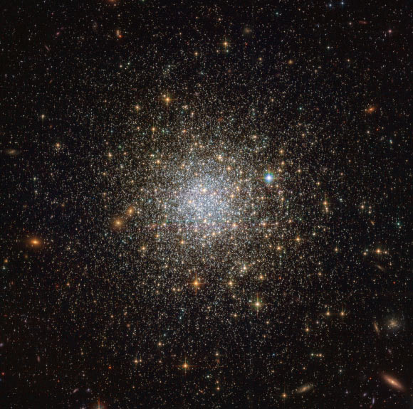 This Hubble image reveals an ancient, glimmering ball of stars called NGC 1466. It is a globular cluster that is slowly moving through space on the outskirts of the Large Magellanic Cloud. NGC 1466 has a mass equivalent to roughly 140,000 Suns and an age of around 13.1 billion years, making it almost as old as the Universe itself. Image credit: NASA / ESA / Hubble.